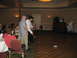 1988 Ford Bronco - A wedding reception scene with guests mingling and dancing on a checkered floor.