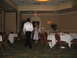 1988 Ford Bronco - A wedding reception is set up with tables and chairs, and guests are mingling.