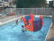 2003 Yamaha RAPTOR 80 - Children enjoy a sunny day playing in an inflatable pool toy in a backyard swimming pool.
