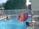 2003 Yamaha RAPTOR 80 - Kids enjoy a summer day in the pool with an inflatable toy.
