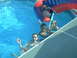 2003 Yamaha RAPTOR 80 - Kids enjoy a sunny day at the pool, playing on an inflatable slide and splashing in the water.