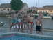 2003 Yamaha RAPTOR 80 - A group of children with shaving cream on their faces stand by a pool, with houses and a boat visible.