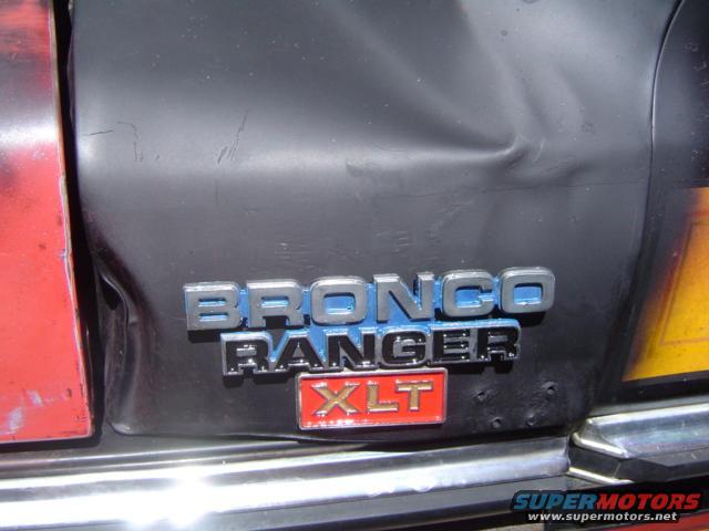 Bronco Ranger XLT emblem on dented rear panel