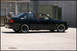 1998 BMW 3 Series - Side view of a black coupe with aftermarket wheels.