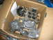 1992 Ford Mustang - Carburetor and fuel pump parts in a cardboard box, ready for installation or shipping.