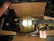 1992 Ford Mustang - A brake booster and master cylinder assembly is shown in a cardboard box, with a tag labeled "Wheel" attached.