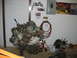 1992 Ford Mustang - Engine assembly on a stand in a garage setting with various tools and posters on the wall.