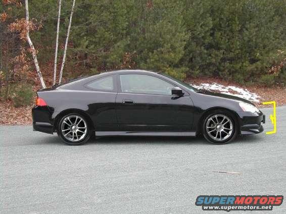 Side view of a black coupe with aftermarket wheels