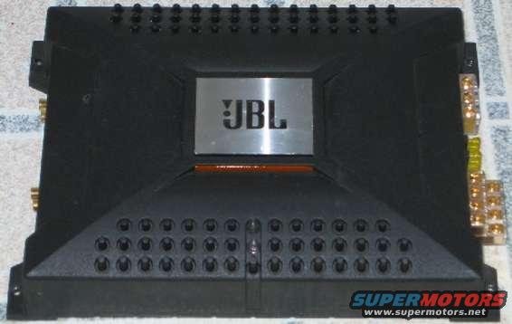 Black JBL car amplifier with silver logo and orange accent light