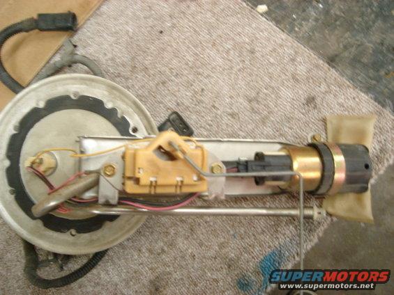 Fuel pump assembly with float arm and filter sock