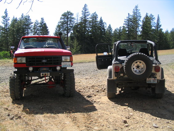 Red Ford truck with snorkel and winch, front view. License plate reads 'GOTFLEX'