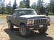 1979 Ford Bronco - 1979 Ford Bronco with lifted suspension and off-road tires parked outdoors.