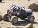 1979 Ford Bronco - Custom buggy with roll cage and off-road tires parked on rocky terrain.