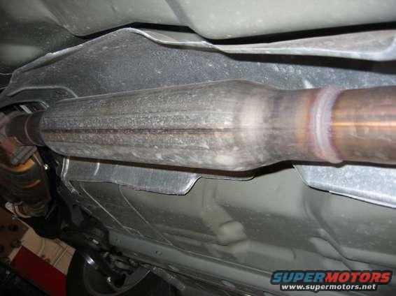 middle muffler + heat sheild under passenger compartment