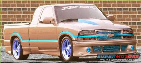 Tan pickup truck with blue accents and custom grille