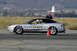 1993 Ford Probe - A silver 1993 Ford Probe races on a track, marked with numbers and surrounded by cones.