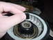 1989 BMW 3 Series - Close-up of a hand interacting with an unidentified automotive component.