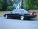 2002 Ford Crown Victoria - This black 2002 Ford Crown Victoria LX Sport sedan is seen from the side parked on a residential street.