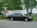 2002 Ford Crown Victoria - Black 2002 Ford Crown Victoria parked near a sign.