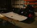 2002 Ford Crown Victoria - A black 2002 Ford Crown Victoria is shown with its hood and trunk open, while a removed headliner rests on a table in front of it.