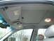2002 Ford Crown Victoria - Interior view of a car's ceiling, showing the sunroof and sun visors.