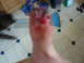 1994 Ford Bronco - A close-up of an injured foot is shown, with a dog and broom visible in the background.