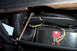 1968 Ford Mustang - Close-up view of wiring and flexible ducting under the dashboard of a vehicle.