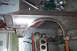 1968 Ford Mustang - Car fender and engine parts are visible in a workshop setting.