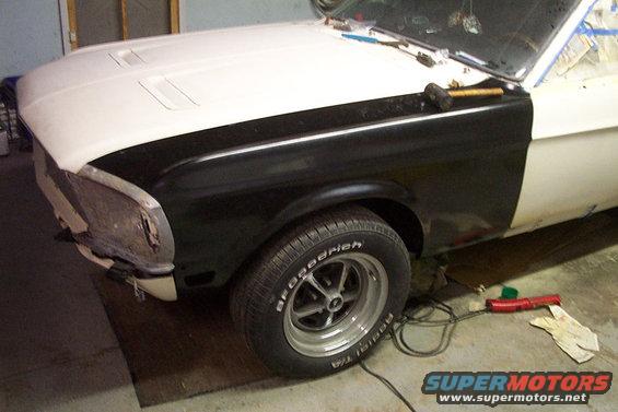 1967 Ford Mustang front fender and hood, black and white paint, damaged front bumper