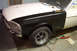 1968 Ford Mustang - A partially restored 1967 Ford Mustang shows off its new black fender and white hood.
