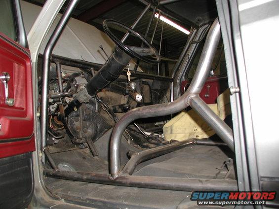 cage in front, bend around seat