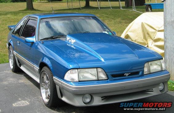 Blue 1990 Ford Mustang with aftermarket hood