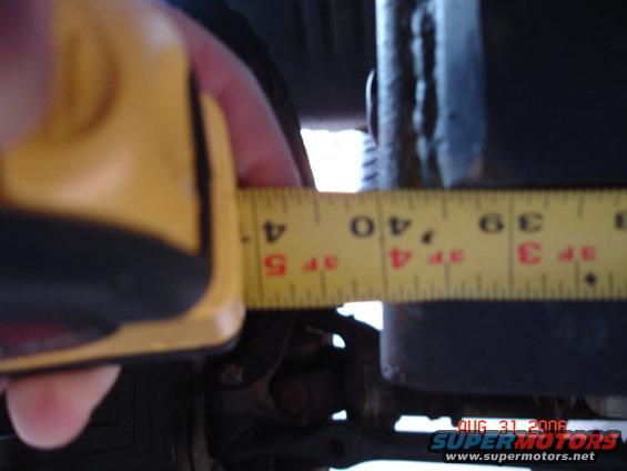 Measuring suspension component with tape measure