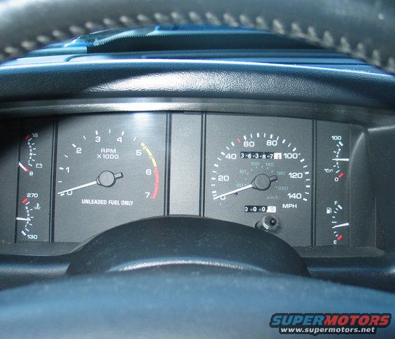 1990 Ford Mustang interior dashboard gauges with speedometer and tachometer