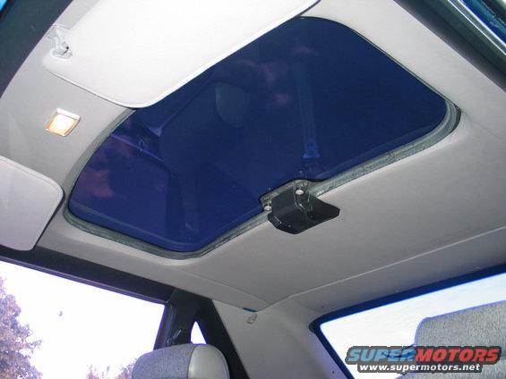 interior shot of car sunroof, with a small light on the left