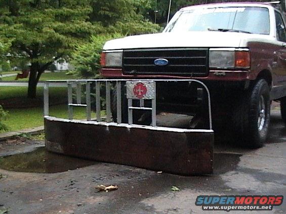 1990 Ford Bronco front view with plow attachment and fire department emblem