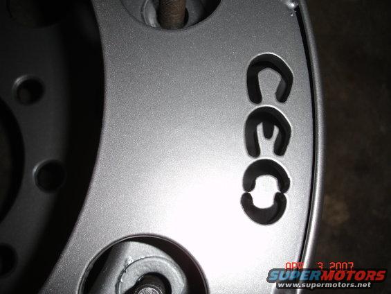 Silver wheel with black text CEC