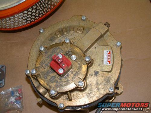 Brass propane converter with red cap and air filter component