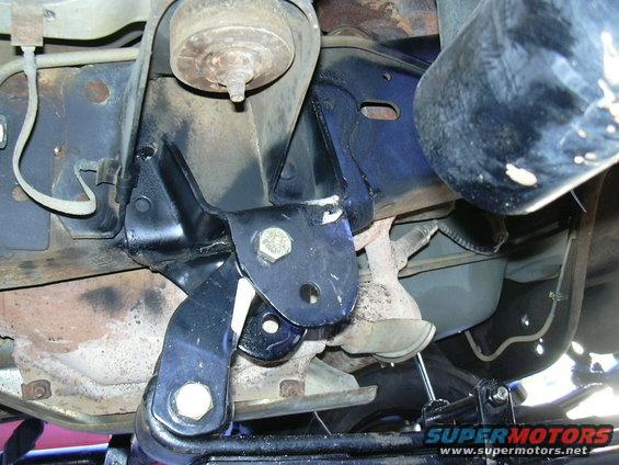 close-up of vehicle suspension parts, likely a solid axle swap modification