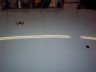 1998 Ford Crown Victoria, white, parked indoors on a light gray floor