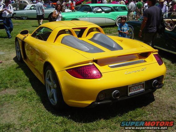 Yellow Porsche Carrera GT rear view with Carrera GT badging