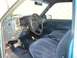 1964 Volkswagen Beetle - Interior view of a blue truck, showing the driver's side dashboard and seating area.