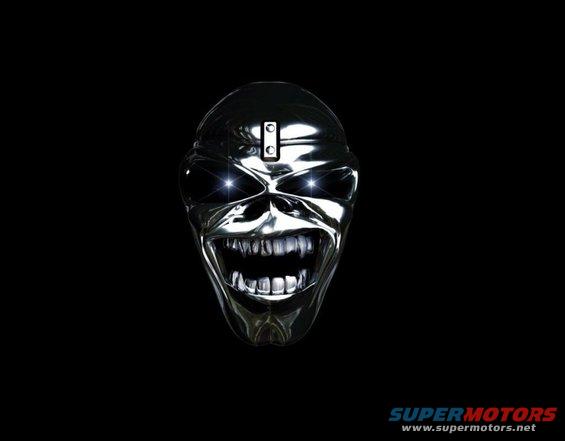 chrome skull mask with glowing eyes and bared teeth