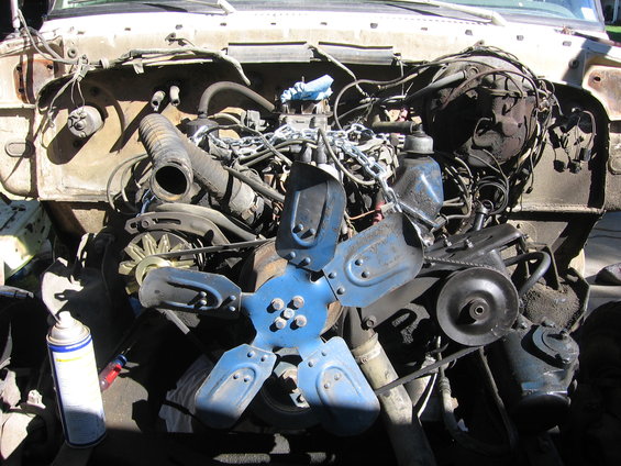 Engine bay with blue fan and spray can
