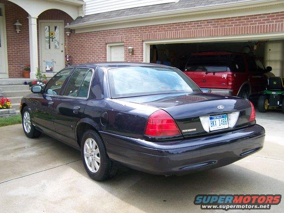 Dark blue 2003 Ford Crown Victoria rear view with license plate BKK 1488