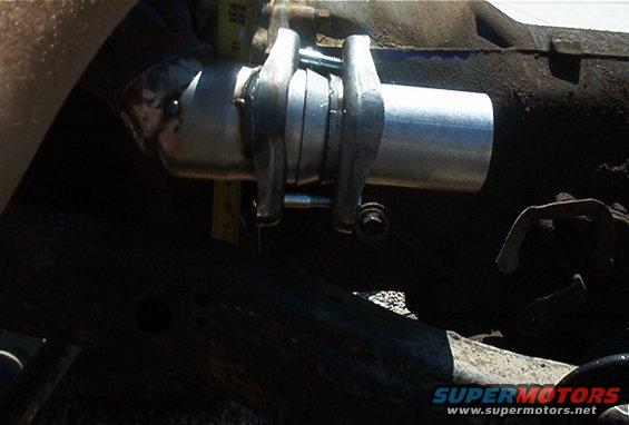 close-up of a newly installed exhaust pipe section with clamps