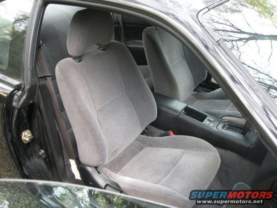 1995 Nissan 240SX interior showing grey cloth front seats and center console