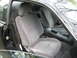 1995 Nissan 240SX - Interior view of a 1995 Nissan 240SX, highlighting the grey cloth seats and dashboard.