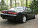 1995 Nissan 240SX - Rear view of a black 1995 Nissan 240SX coupe parked outdoors.