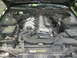 1995 Nissan 240SX - View of the engine bay of a Nissan vehicle, including the V6 engine and associated components.